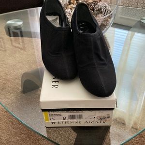 Etienne Aigner black cloth shoe with patent wedge heel.